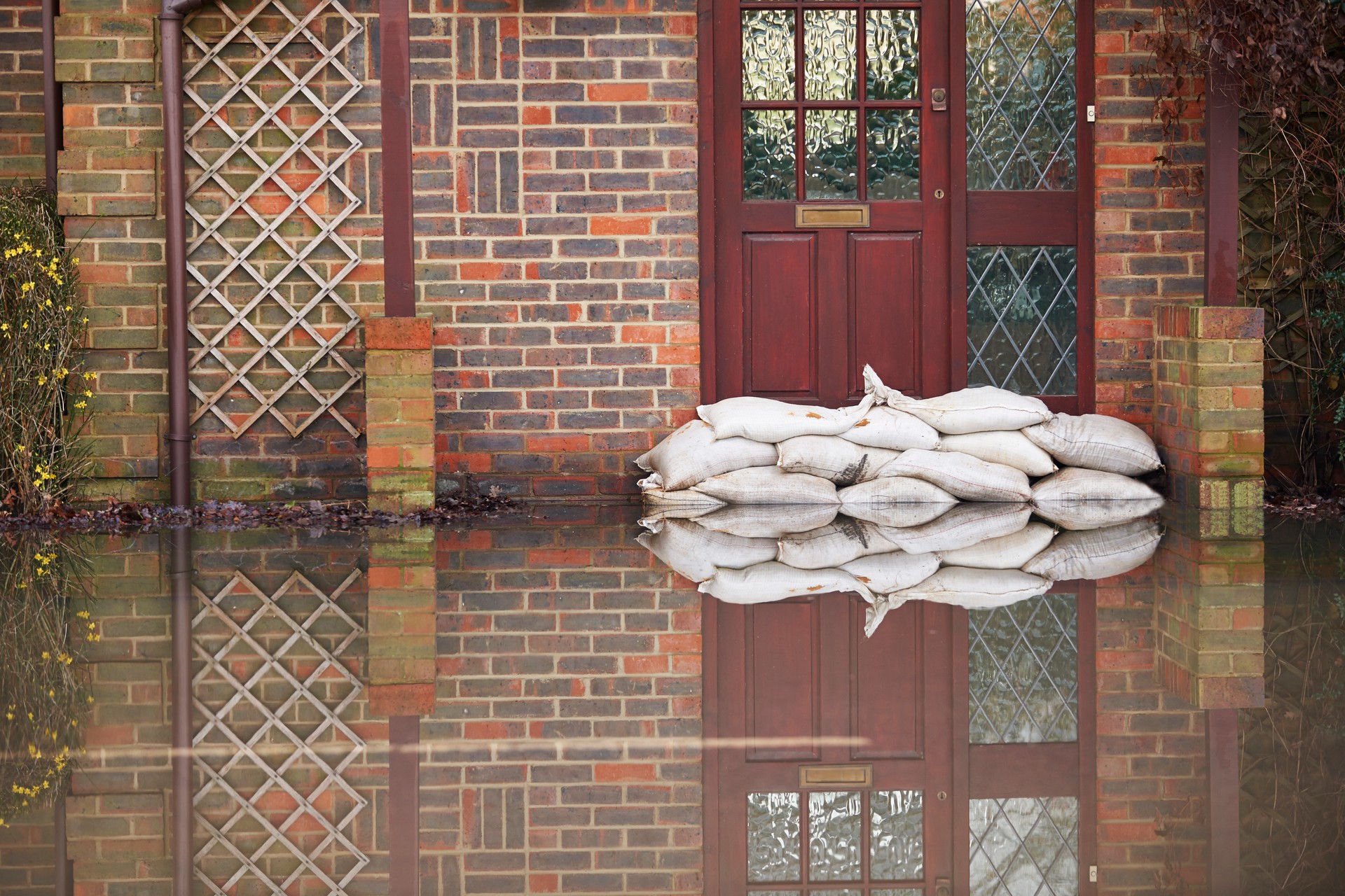 Sandbags near house door during flood